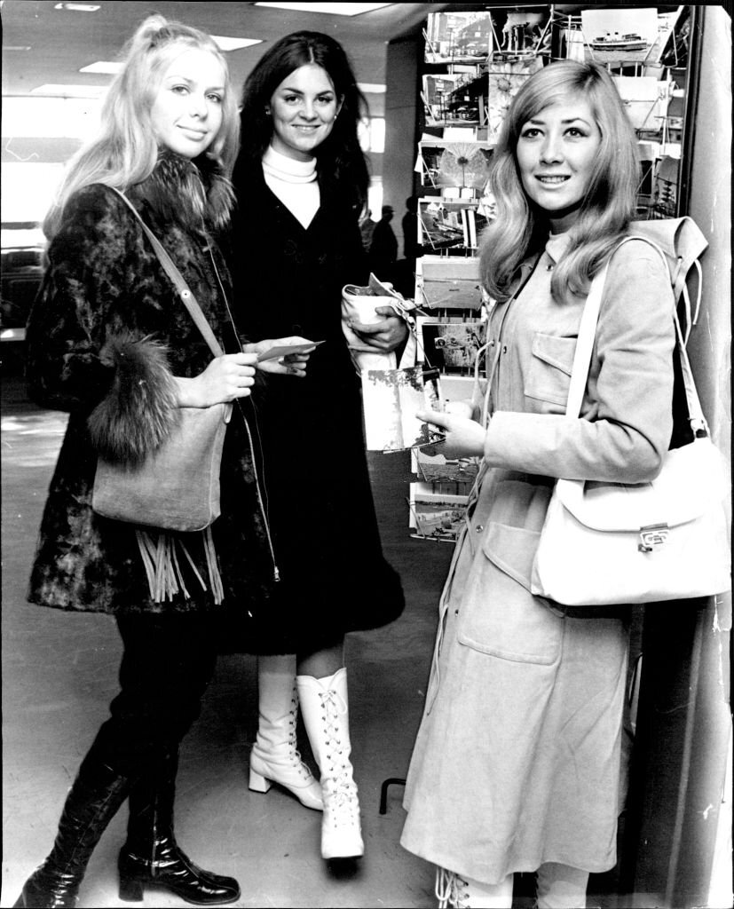 #39 Miss P. August of S. Australia, Miss S. McElhinney of Victoria and Miss D. Van Emmerik shop for postcards during their stop at Sydney today.