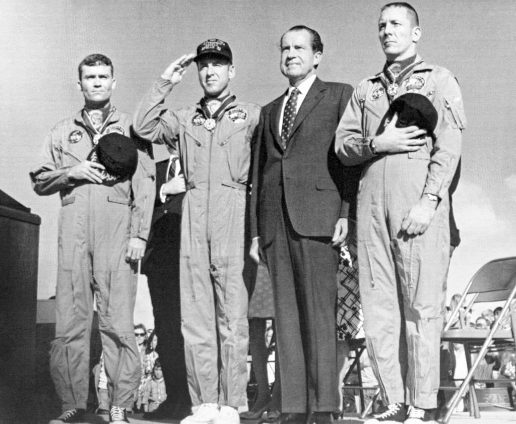 #9 The Apollo 13 astronauts join President Richard Nixon for the playing of the national Anthem during ceremonies.