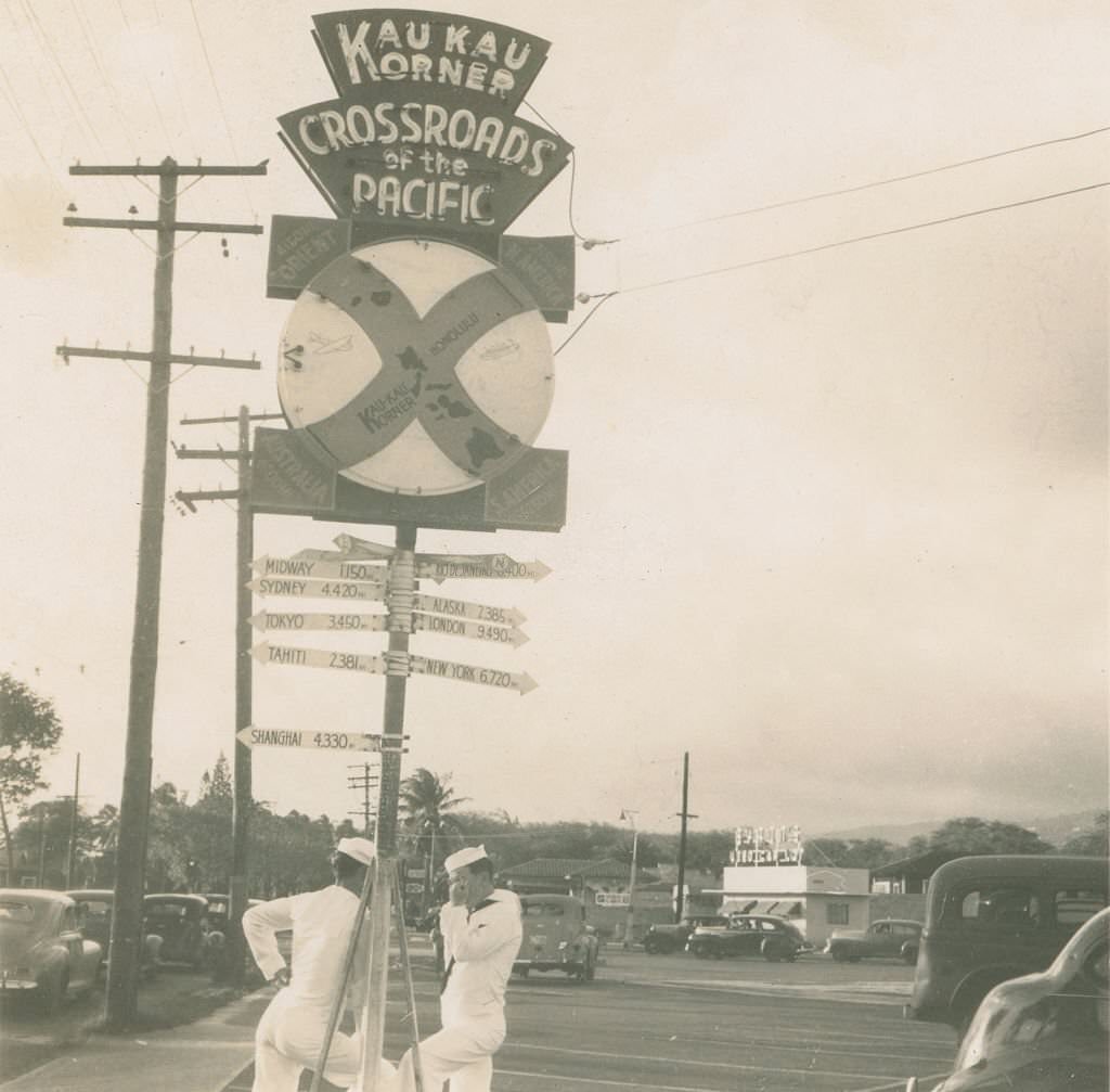 #89 Sailors standing by Crossroads of the Pacific sign, 1940s