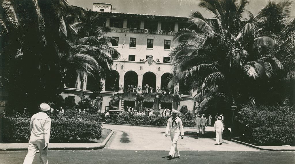 #95 Sailors walking in front of six story building, 1940s