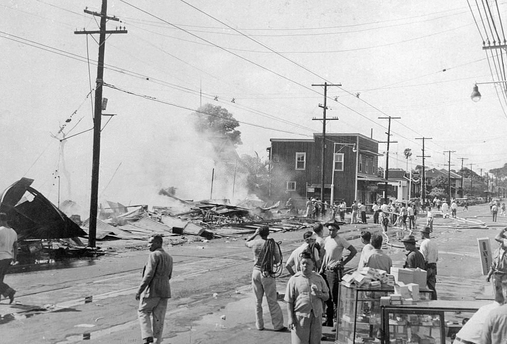 #135 Stunned residents view the damage after the Attack on Pearl Harbor, Honolulu, Oahu, Hawaii, December 7, 1941.