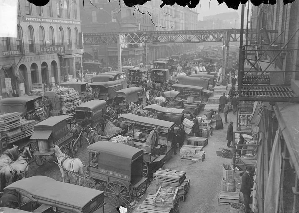 #123 South Water Street Market looking west toward the elevated train tracks over Wells Street, Chicago, Illinois, 1904.