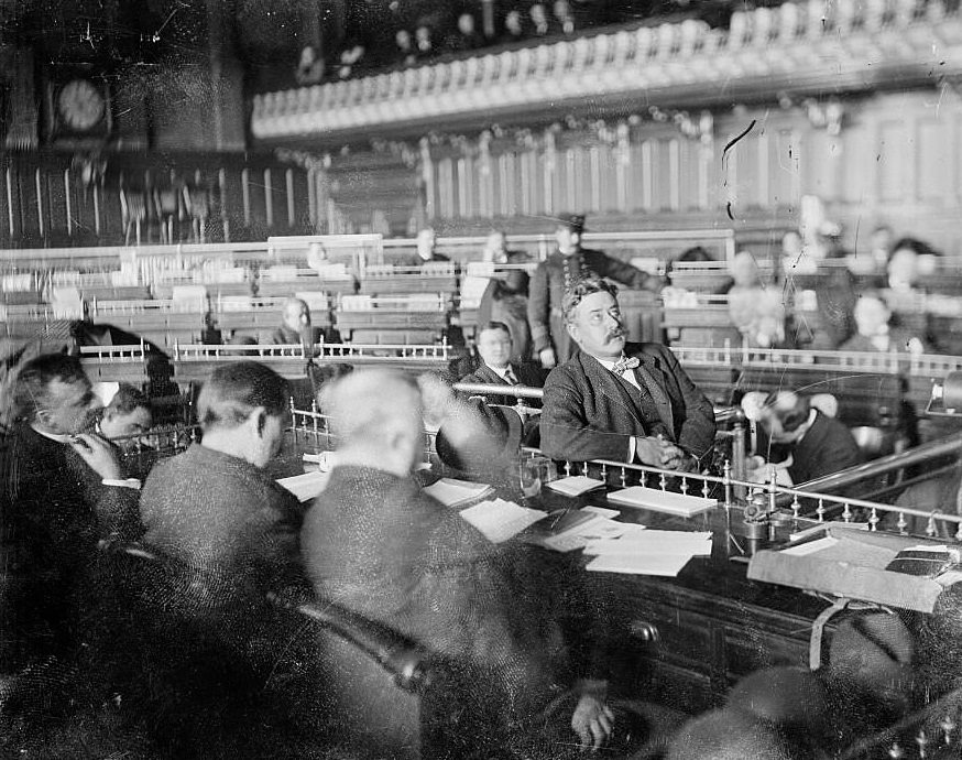 #124 Mayor Carter H Harrison, looking up while testifying during the Iroquois Theater fire inquest, Chicago, Illinois, January 1904.