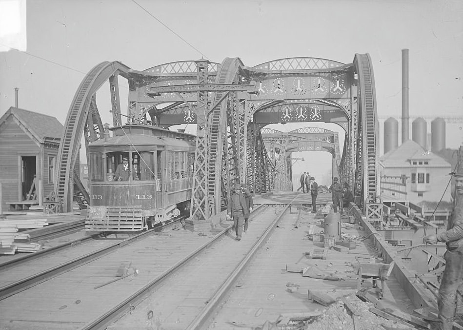#140 Streetcar driving on one lane of the Ninety-fifth Street Bridge, spanning the Calumet River in the South Chicago community, while construction work is being done, Chicago, Illinois, March 19, 1903.