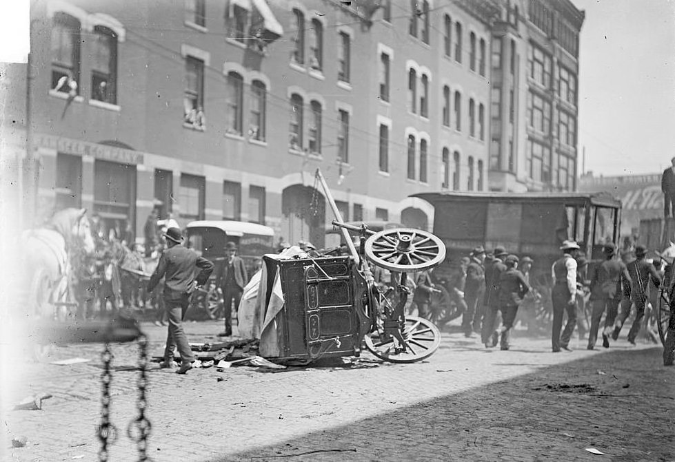 #165 Cart overturned during a teamsters strike, June 4, 1902.