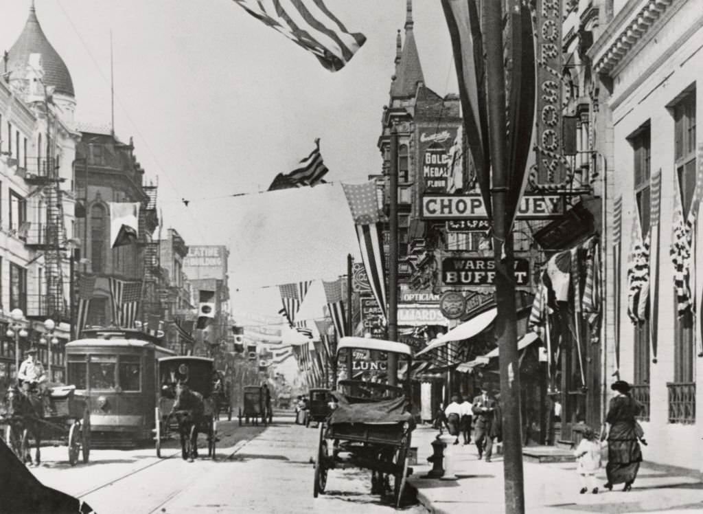 #43 Horse-drawn carriages and a streetcar in the ‘Little Poland’ section of Milwaukee Avenue and Division Street in Chicago, Illinois, 1905