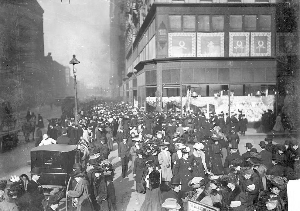 #211 Crowds of Christmas shoppers crossing the street and walking along the sidewalks in downtown, Chicago, Illinois, 1900s.