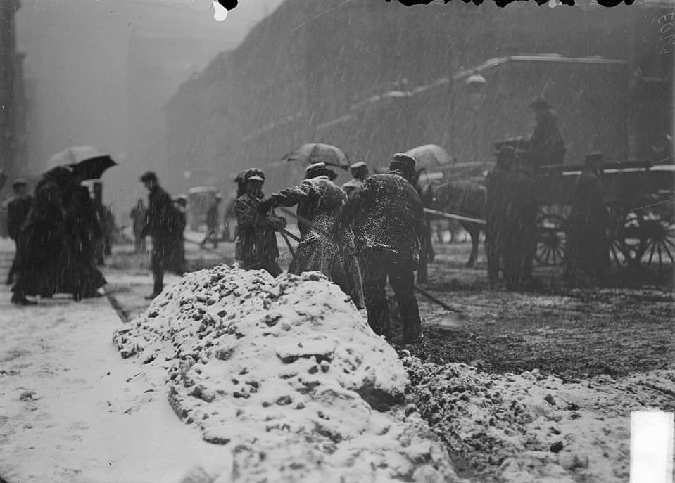 #218 A street covered in snow during a blizzard, Chicago, Illinois, 1900s.