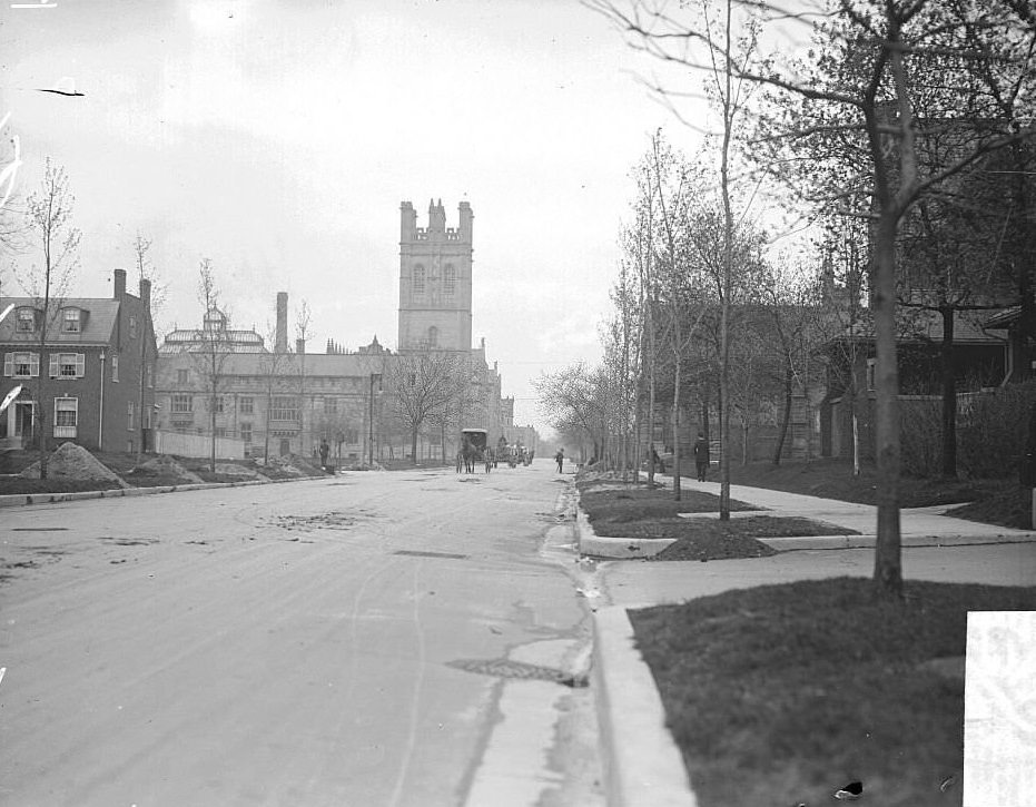 #222 View looking west along East 57th Street from South Kimbark Avenue toward the John J Mitchell tower at the University of Chicago in the Hyde Park community area of Chicago, Illinois, 1900s.
