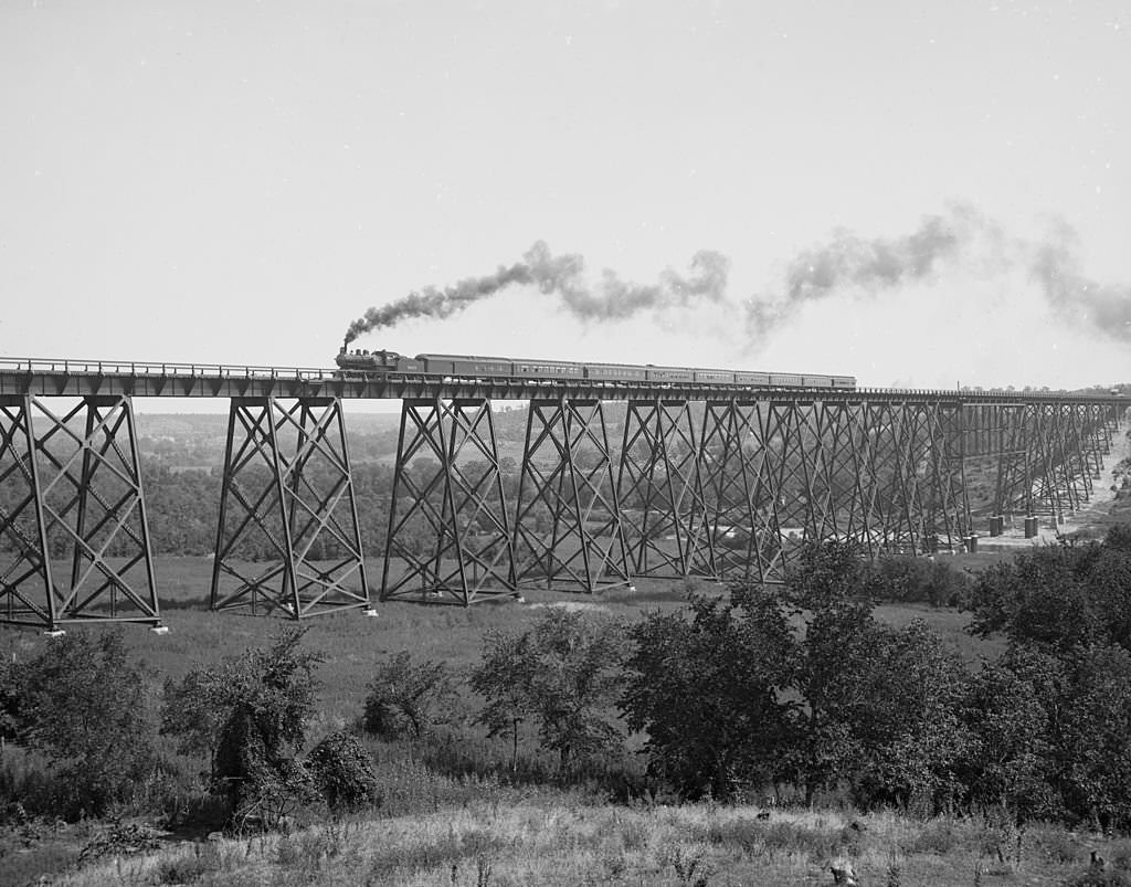 #93 Steam locomotive & Train passes over Valley Trestle Bridge -Chicago & North Western Railway viaduct over Des Moines River, 1900s