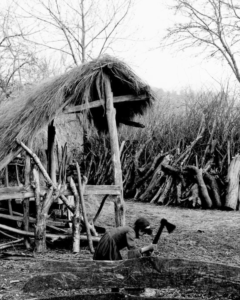 #153 Girl cutting wood, Barella, Galicia, Spain, 1963.