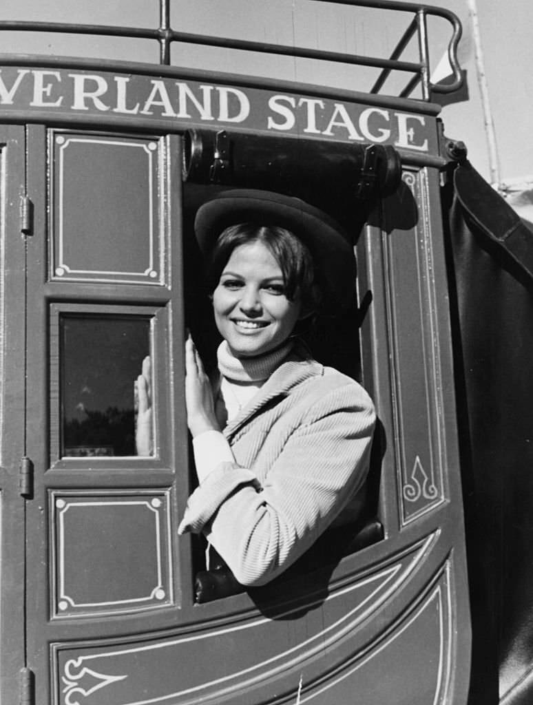 #164 Actress Claudia Cardinale sitting in a Stage Coach, as she appears in the film ‘Circus World’, Spain, November 27th 1963.