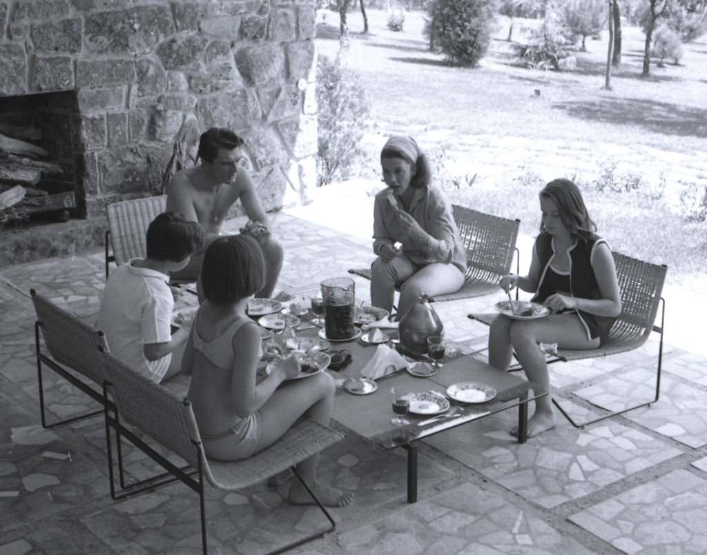 #187 Linda Christian at home of La Moraleja with her husband Edmund Purdom and daughters Romina and Taryn, Madrid, Spain, 1964.
