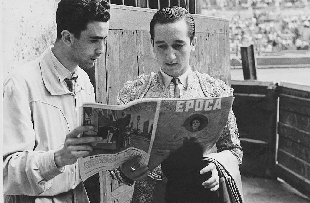 #74 Bullfighter reading the magazine Epoca during a bullfighting. Spain, 1960s