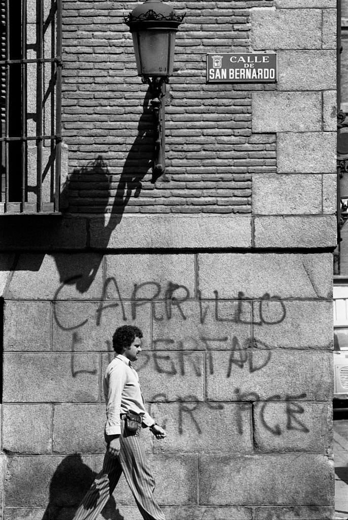 #104 A man walking down San Bernardo Street in Madrid, Spain, August 20, 1977.