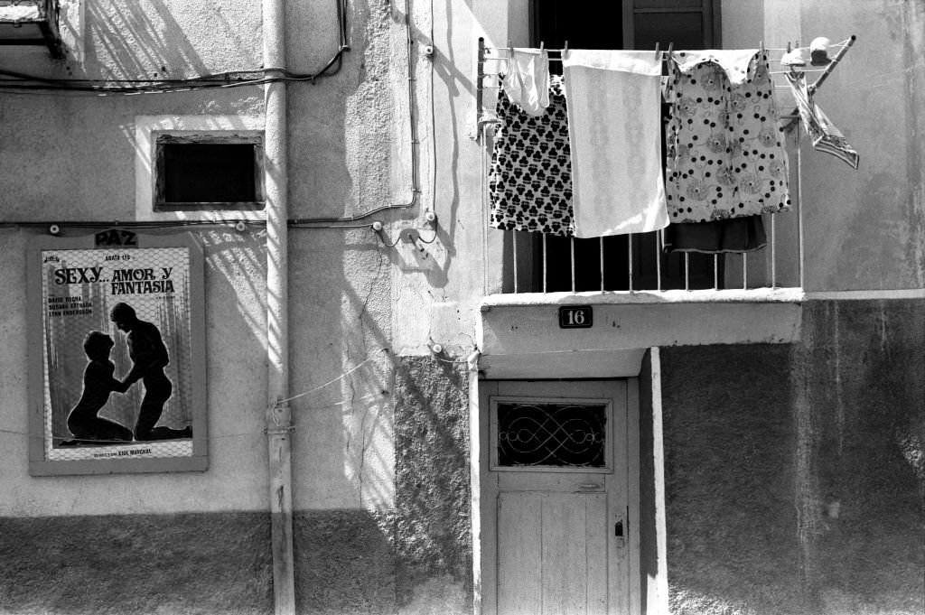 #116 Laundry hanging from a window and movie poster ‘Sexy amor y fantasia’ on September 4, 1977, Villajoyosa in Spain,