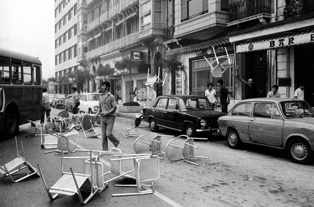 #201 Basque protestors demanding autonomy for the Basque Country attempt to create a street barricade by throwing cafe tables and chairs onto the road in San Sebastian, Spain, 1st September 1979.