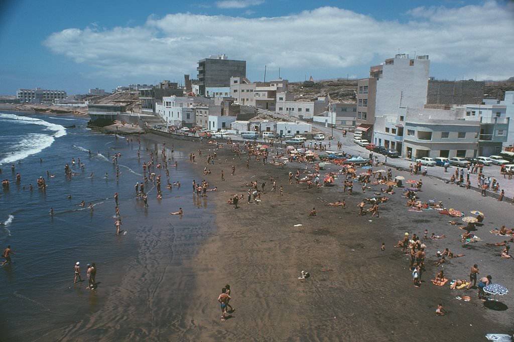 #79 Sunbathers enjoying the beach at El Médano on Tenerife, Canary Islands, Spain, 1975.