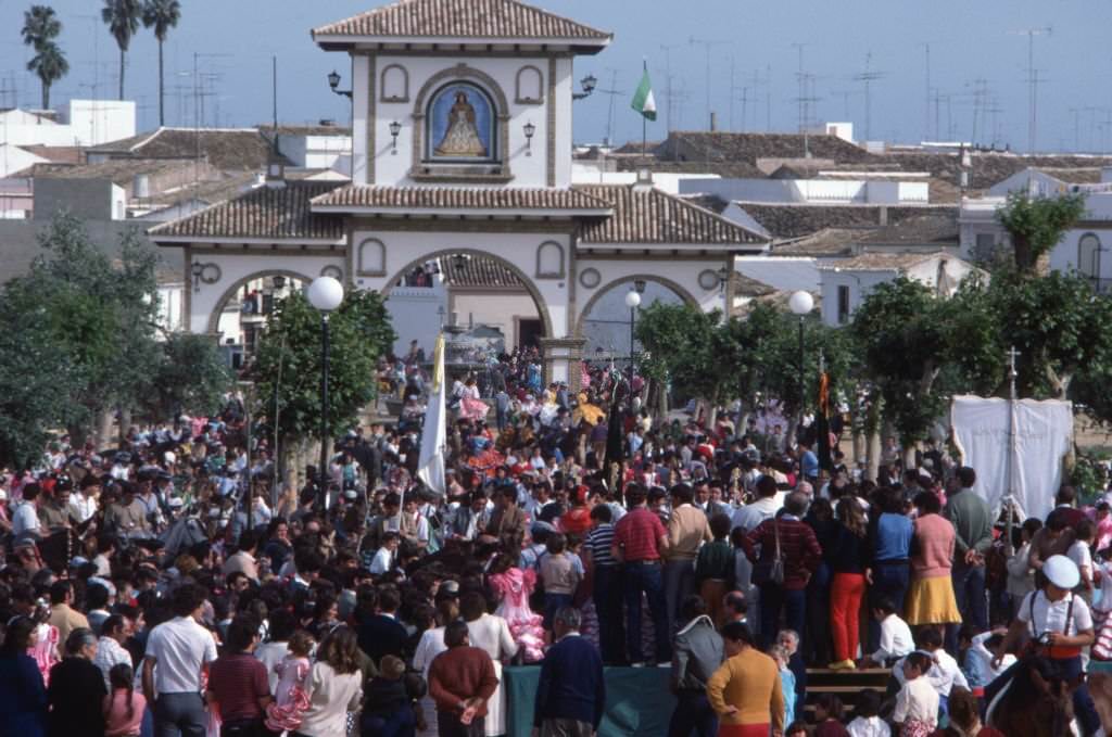 #129 Crowd attending outdoor mass during the El Rocío pilgrimage, in Almonte, in 1983, Spain.