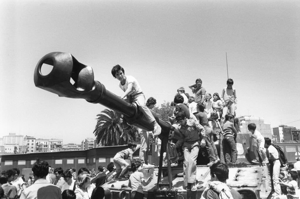 #140 Crowd on a tank during the Army Day parade in Barcelona, May 30, 1981.