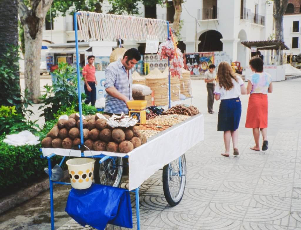 #33 A street vendor on an unspecified street, Almeria, Andalusia, Spain, 1984.