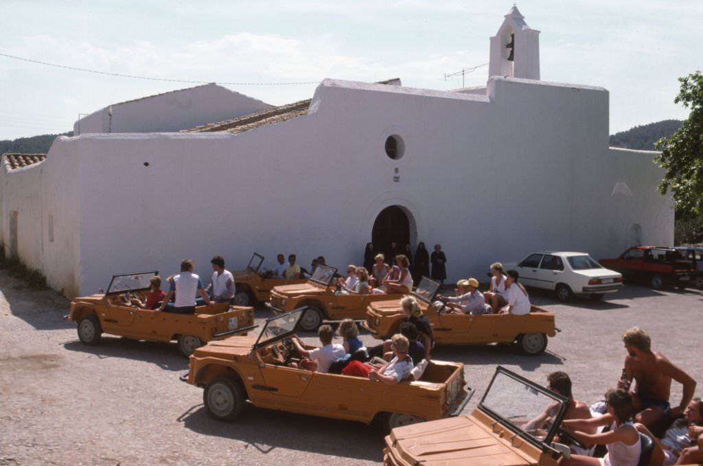 #79 Tourists in ‘Citroën Méhari’ cars in Ibiza, July 1985, Balearic Islands, Spain.