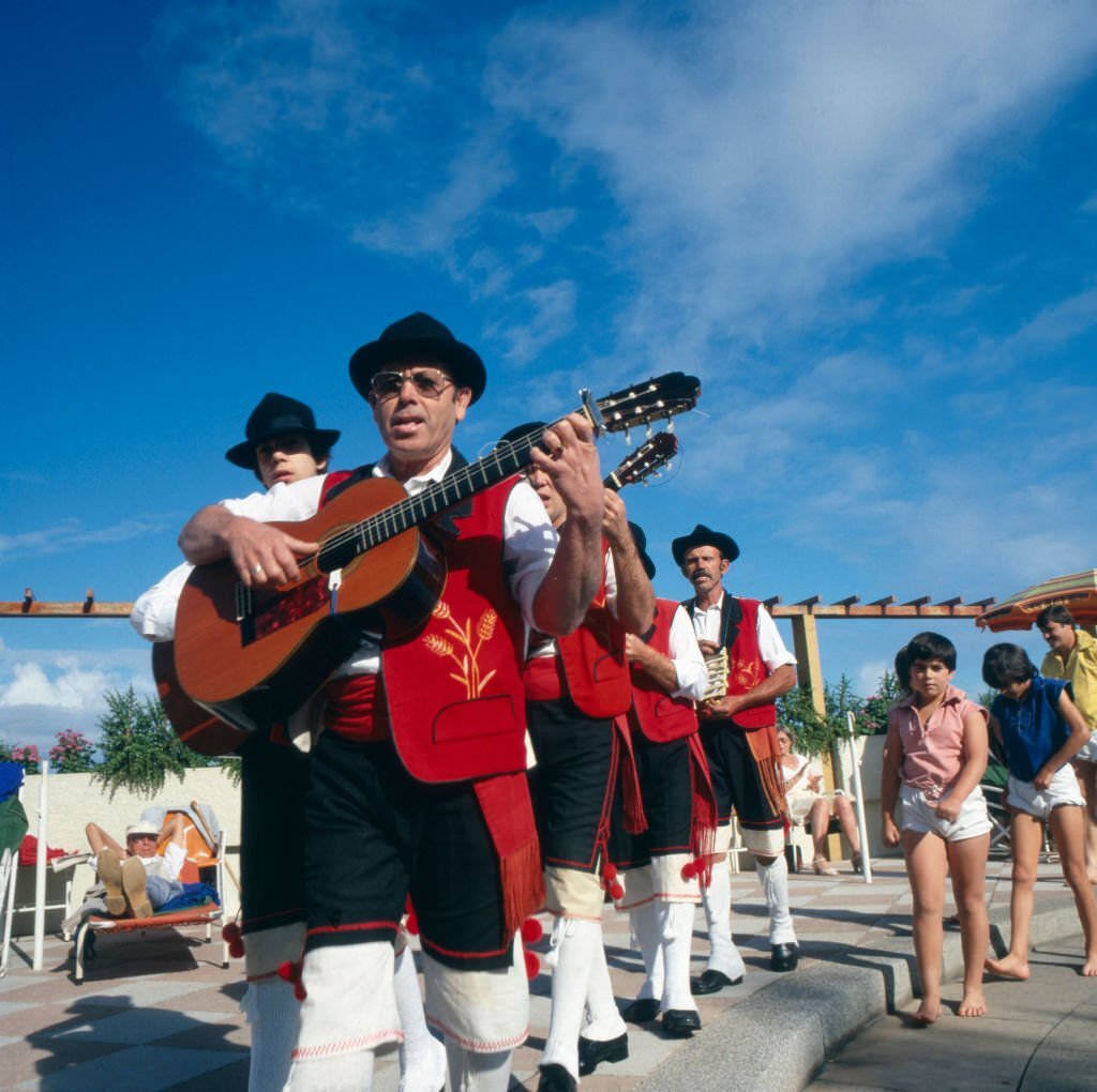 #87 A folklore music group playing traditional tunes at Gran Canaria, Spain 1980s.