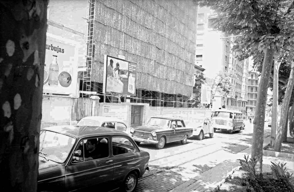 #75 Paseo del General Mola during the building transition process of this urban artery based on the demolition of the single-family homes that characterized it, and their replacement by modern blocks of flats, pecuniam maiorem gloriam, 1971