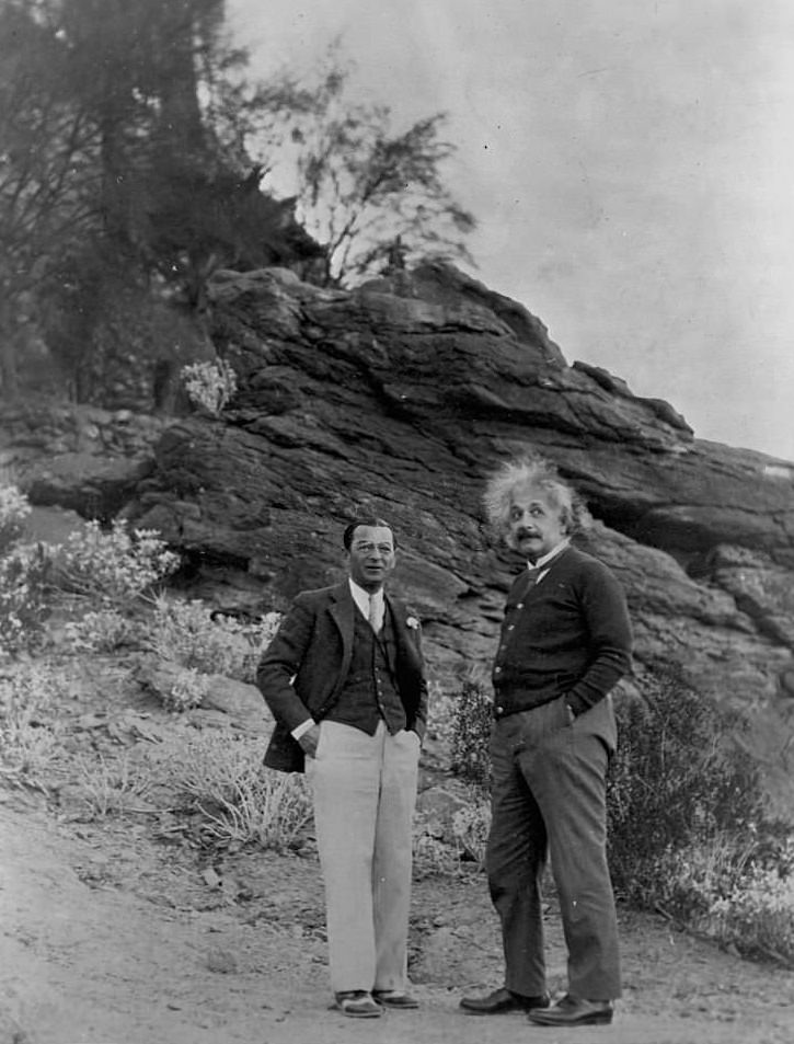 #48 Albert Einstein and Man Standing on Desert Hillside