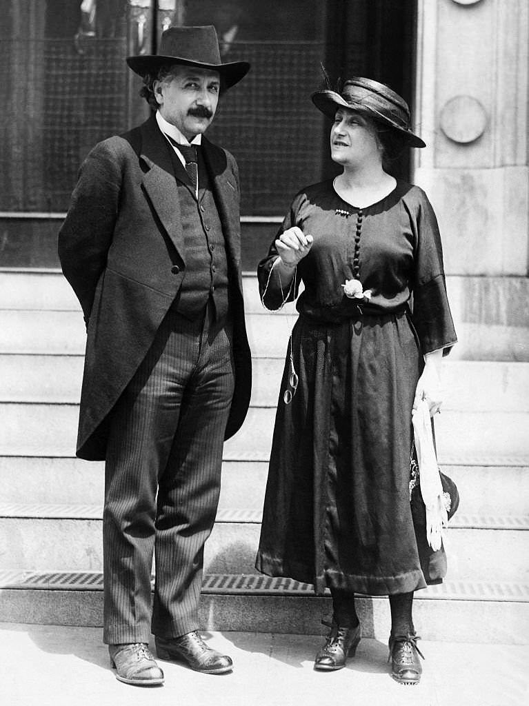#1 Albert and Elsa Einstein chatting near the steps of building