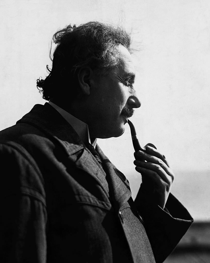 #8 Albert Einstein smoking pipe in profile photograph.