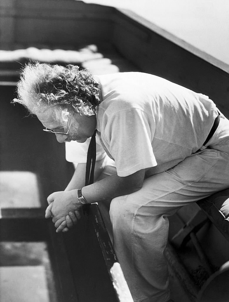 #10 Albert Einstein sitting pensively on the deck of his sailboat.