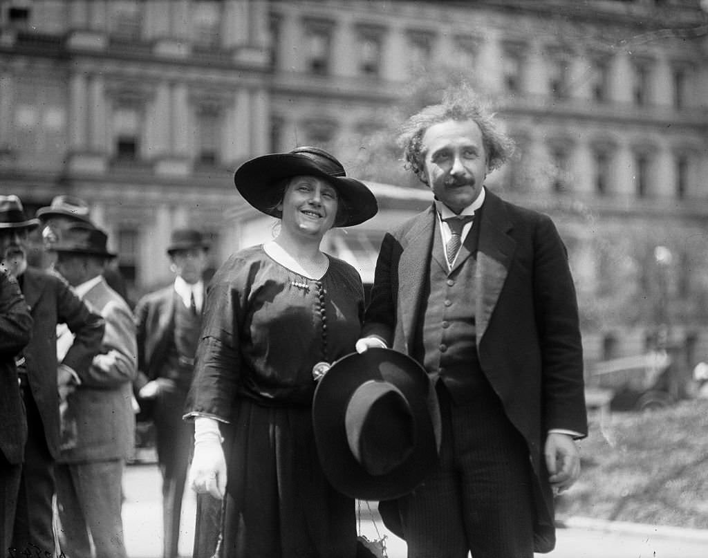 #55 Albert Einstein with his wife Elsa, State, War, and Navy building in background, Washington DC., 1921