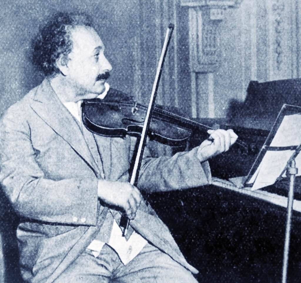 #75 Professor Albert Einstein playing his violin.