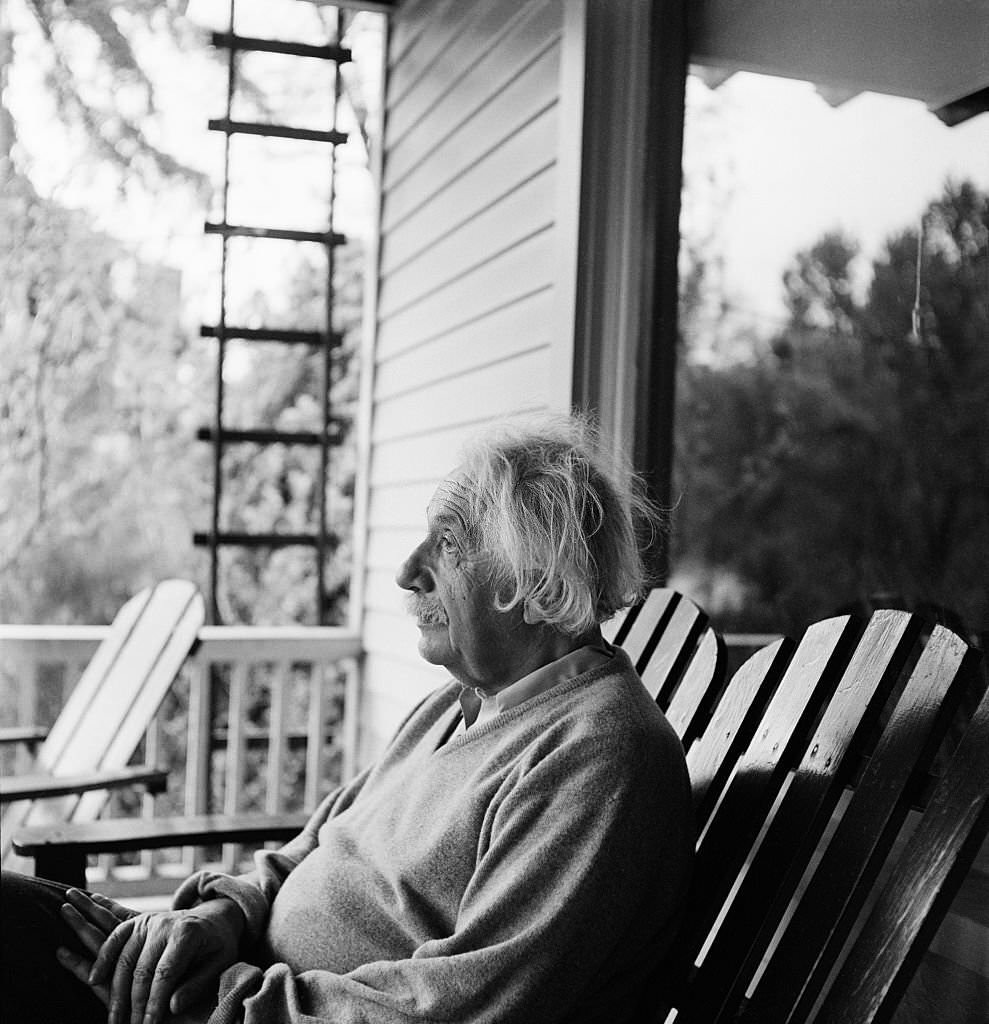 #33 Albert Einstein outside his home in Princeton, New Jersey, where he is professor at the Institute for Advanced Studies, 1951.