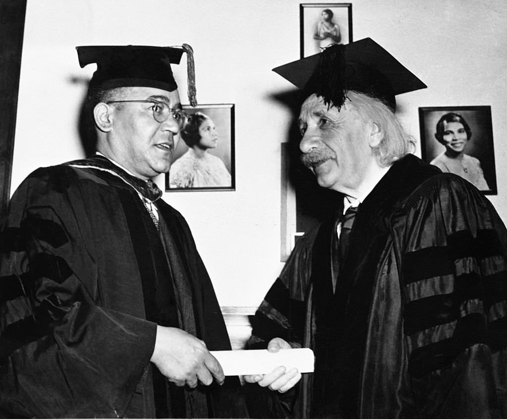 #88 Einstein receives honorary degree from Horace Mann Bond, President of Lincoln University. The photo on wall is singer Marian Anderson.