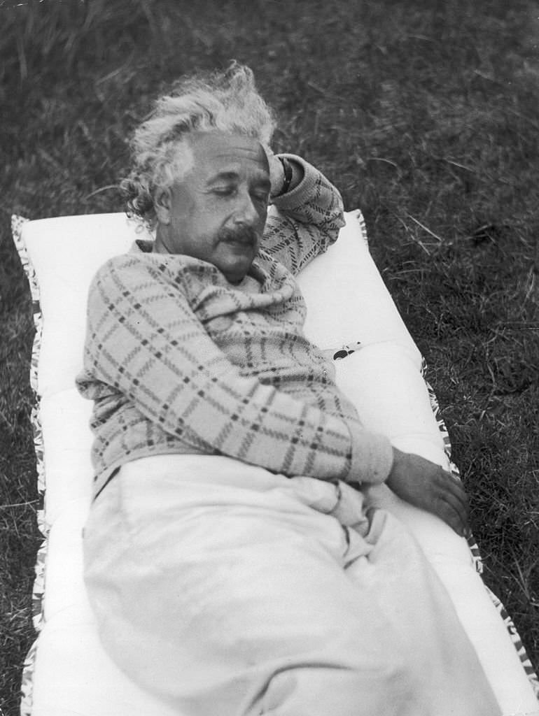 #37 Albert Einstein taking a nap in his yard in Berlin, despite the Nazi threat, in October 1933.