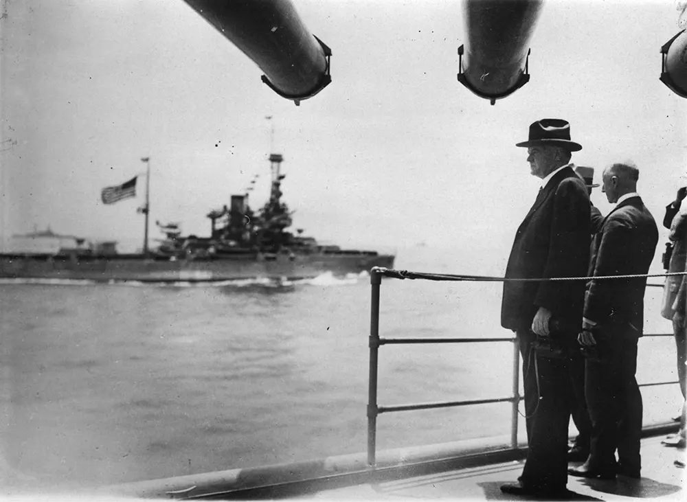 #6 Herbert Hoover stands on board the cruiser USS Salt Lake City, 1931.