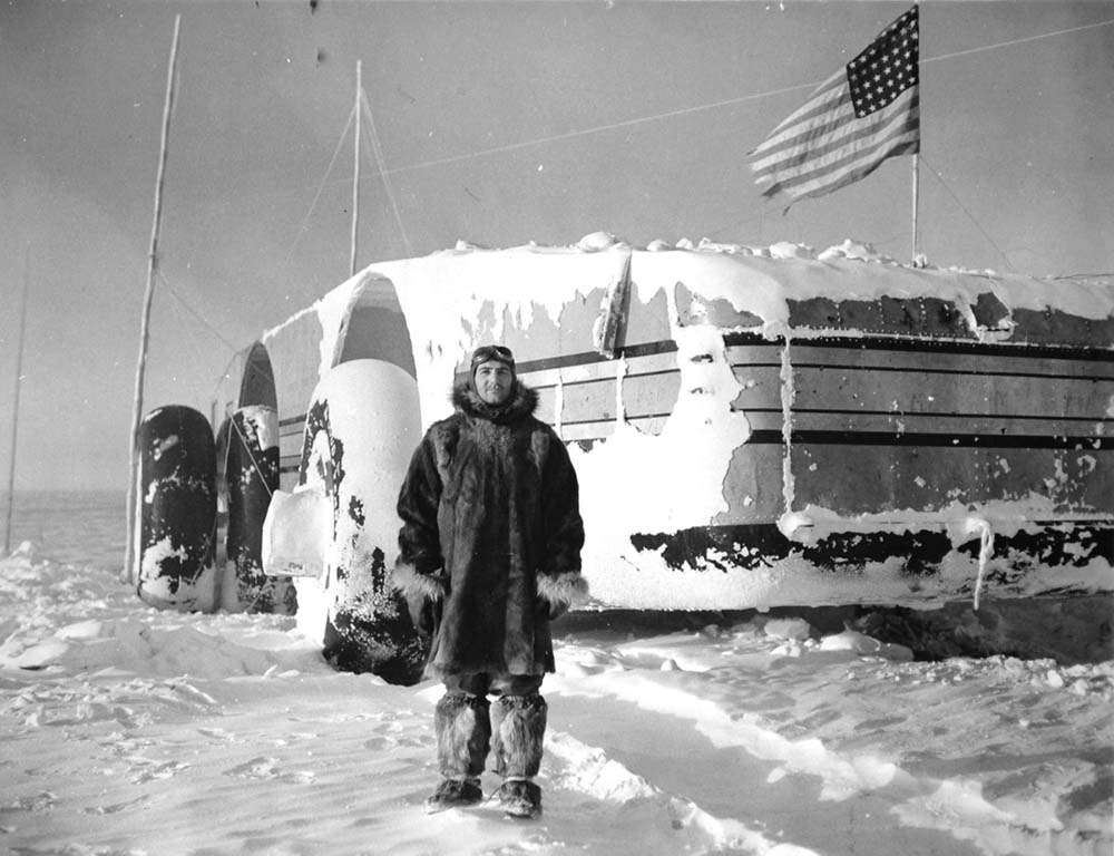 Crew member T.A. Petras stands behind the Snow Cruiser on September 20, 1940.