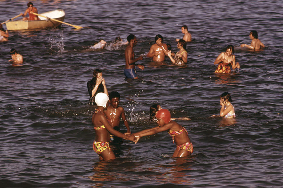 #14 Swimmers take to the water at 12th Street Beach on Lake Michigan, in August of 1973.