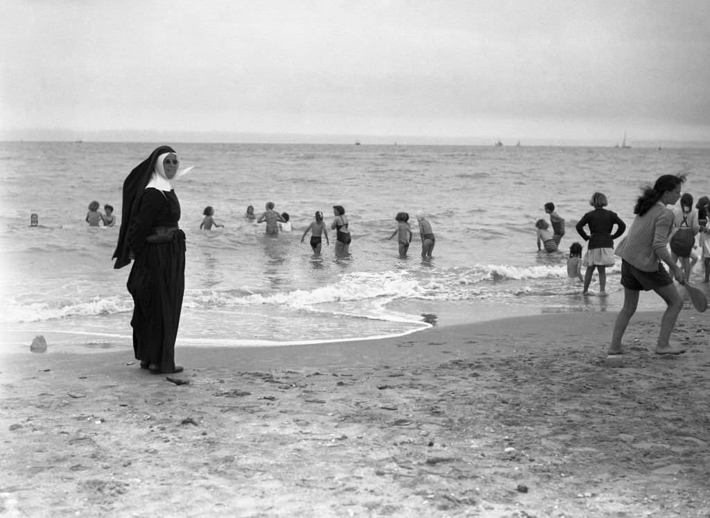 #116 Nun on the beach of Deauville, 1950