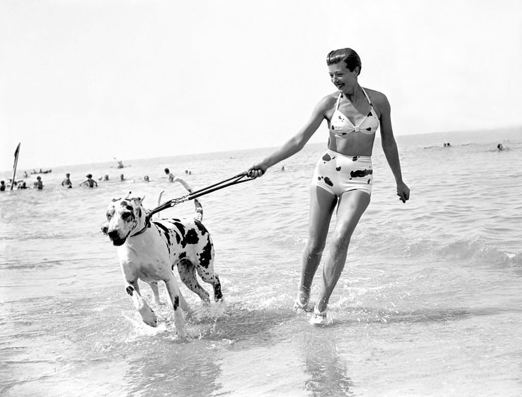 #130 Countess De Bremond D Ars with her dogs at Deauville Beach, 1938