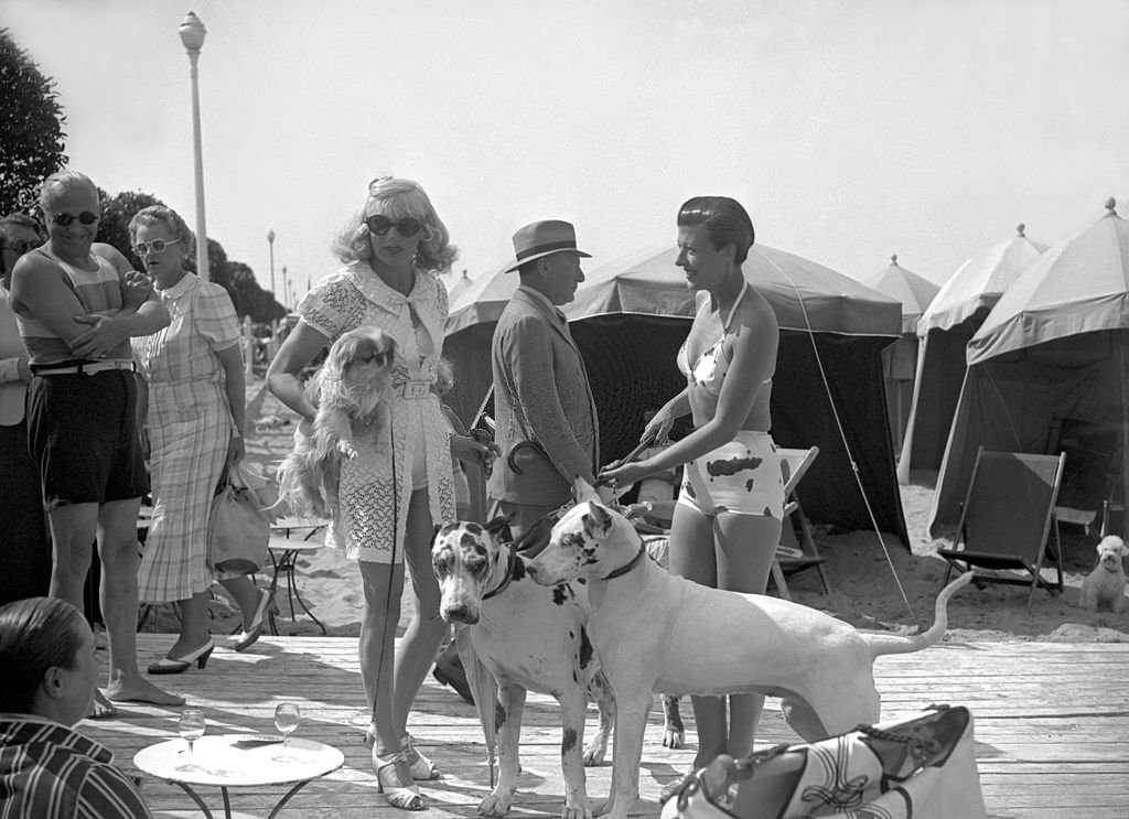 #132 Countess Of Bremond D Ars with her dogs and Princess Natacha Sandroff, 1938.