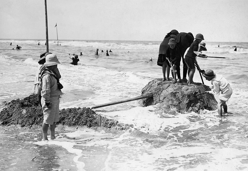 #35 Deauville Children build sand-formations at the beach, 1913