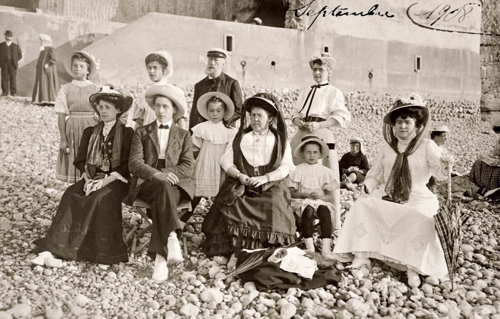 #51 A family group in their Sunday best on a stony beach at Deauville, 1908