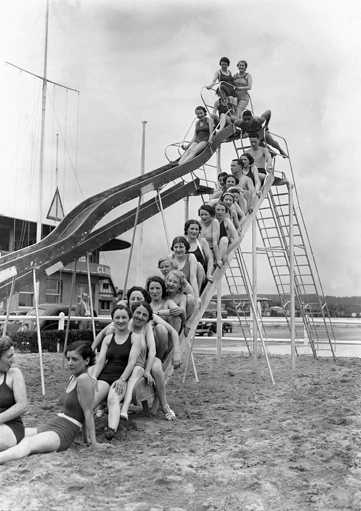 #67 Vacationers in Deauville on a toboggan on the beach on July 7, 1936.