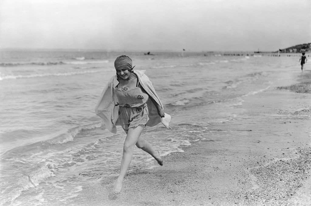 #9 A Young Woman Runs Along the Shore at Deauville, 1924