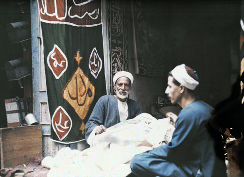 #44 Two men making tents.