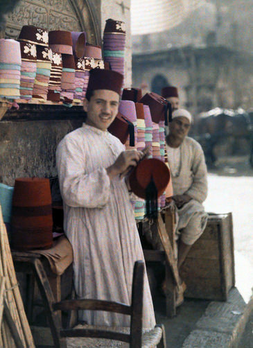#47 Two men work at a tarboosh booth in Cairo.