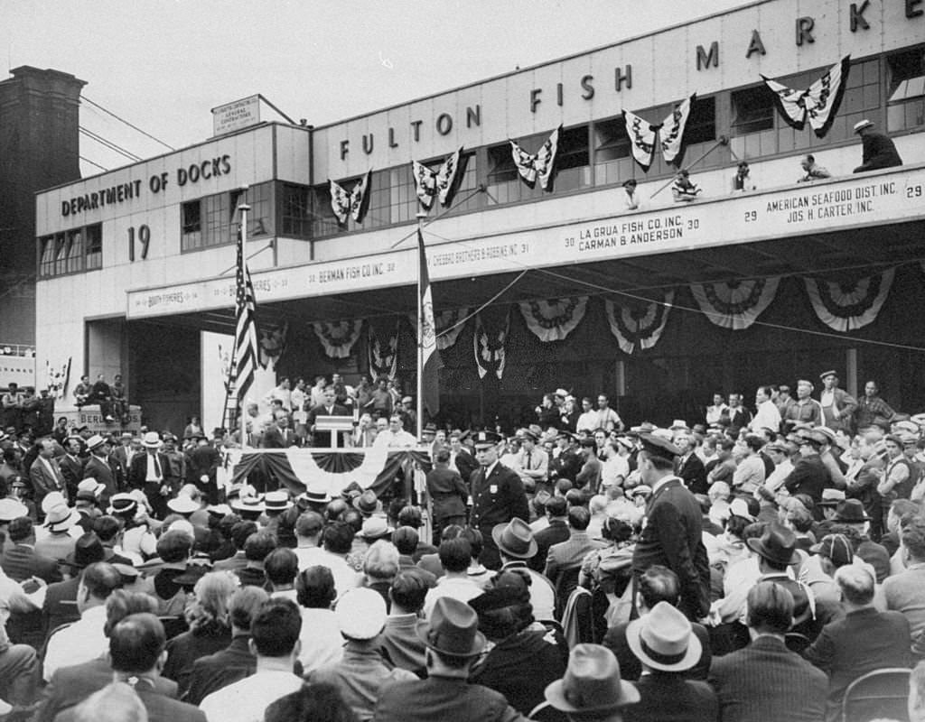 #101 Mayor Fiorello LaGuardia speaking at the opening of the Fulton Fish Market, at Bleecker and South Sts, 1940s